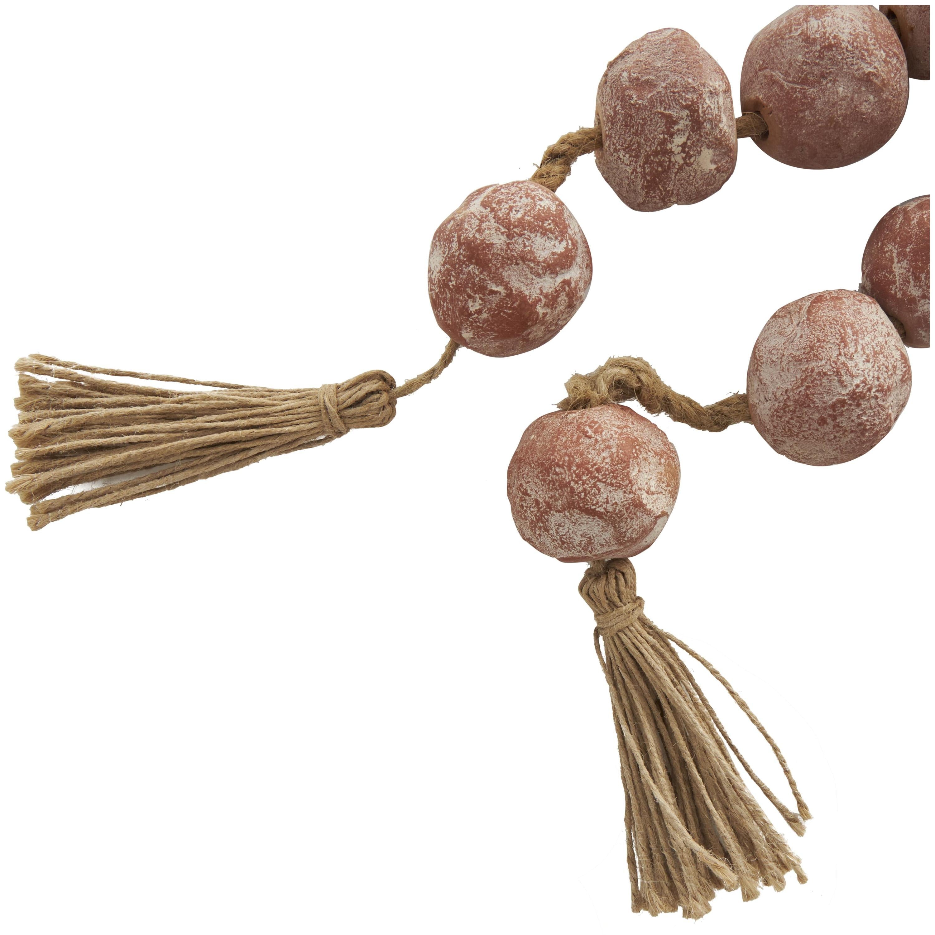 DecMode Handmade Round Intricately Shaped Large Distressed Orange Ceramic Garland with Tassel