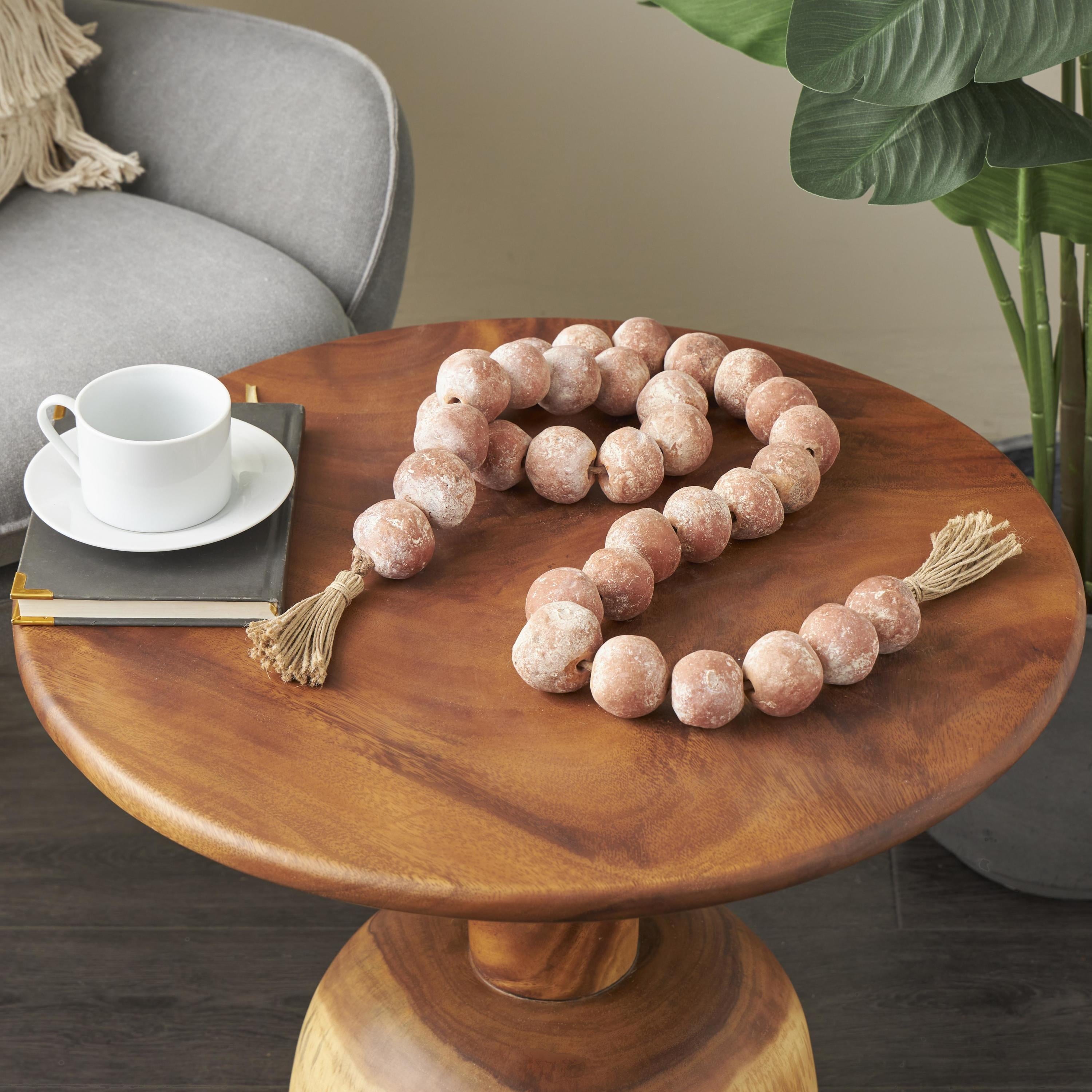 DecMode Handmade Round Intricately Shaped Large Distressed Orange Ceramic Garland with Tassel
