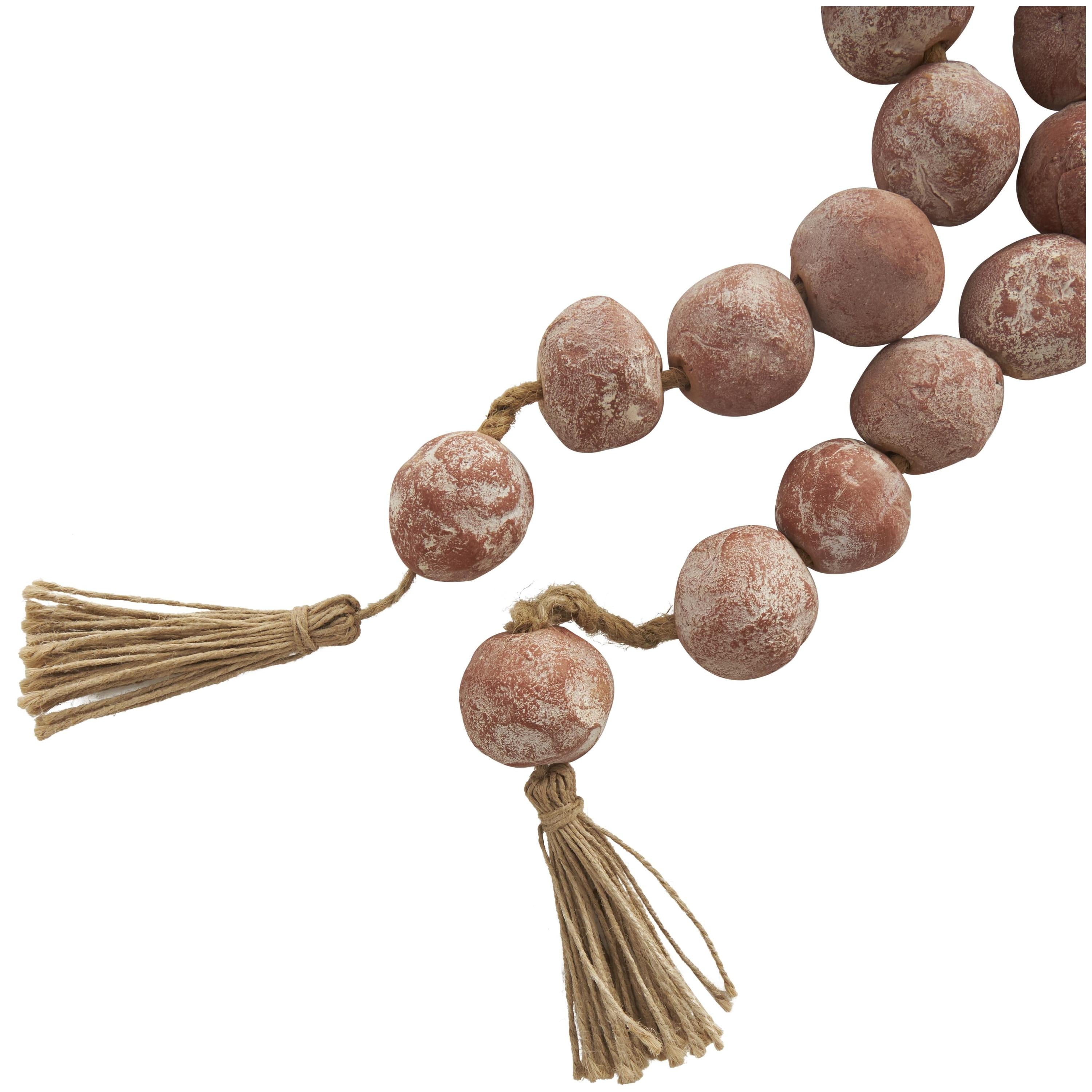 DecMode Handmade Round Intricately Shaped Large Distressed Orange Ceramic Garland with Tassel